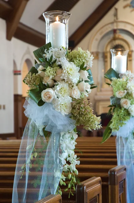 End of Aisle church flowers with candles