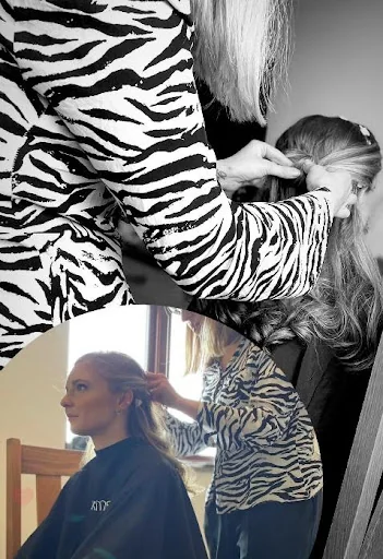 A hairstylist preparing a member of the wedding party's hair.