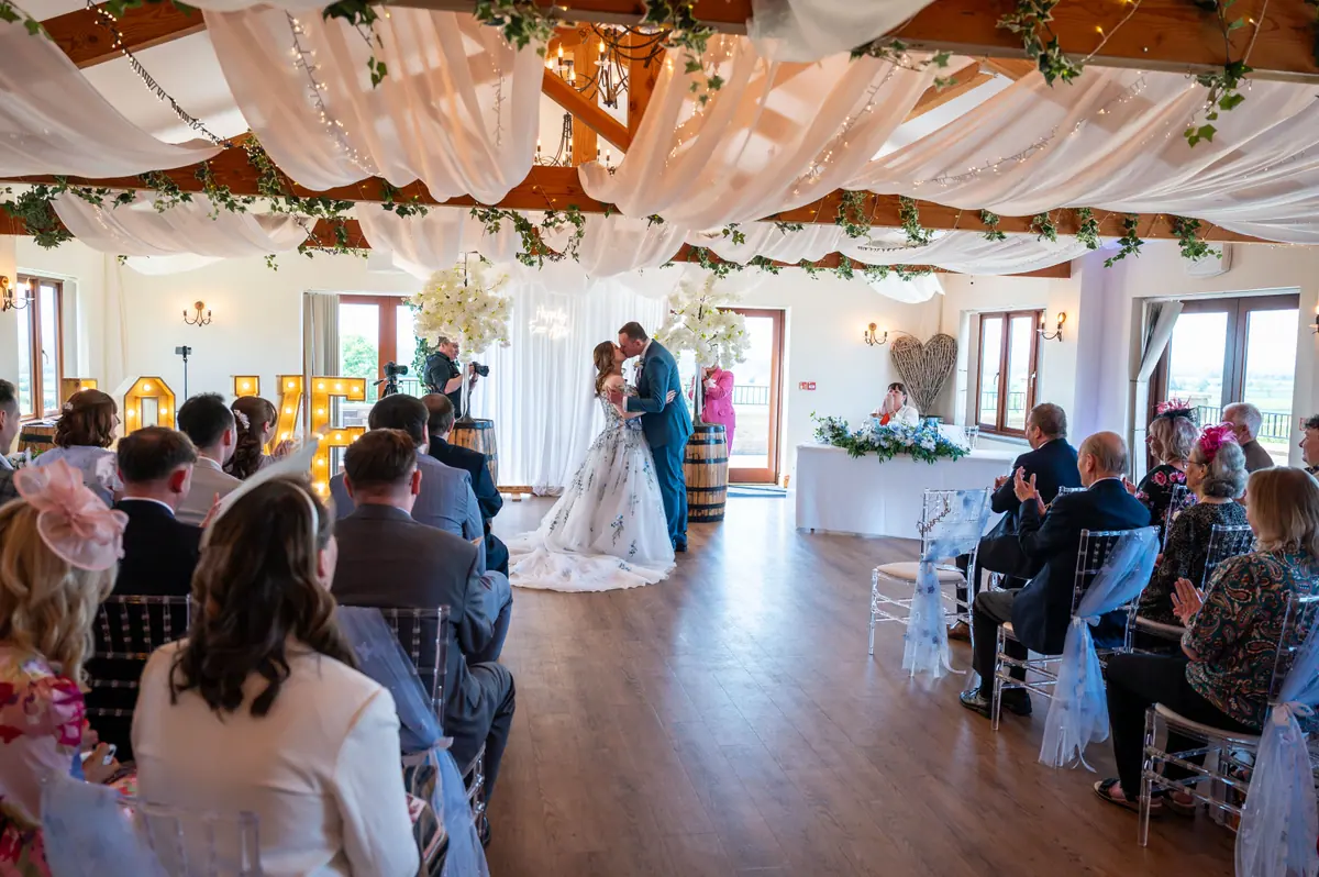 Megan entering the Hall ceremony with guests seated on both sides