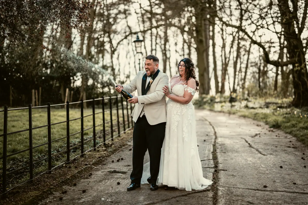 Star and Dan walking together beside the fenced tree-lined lane
