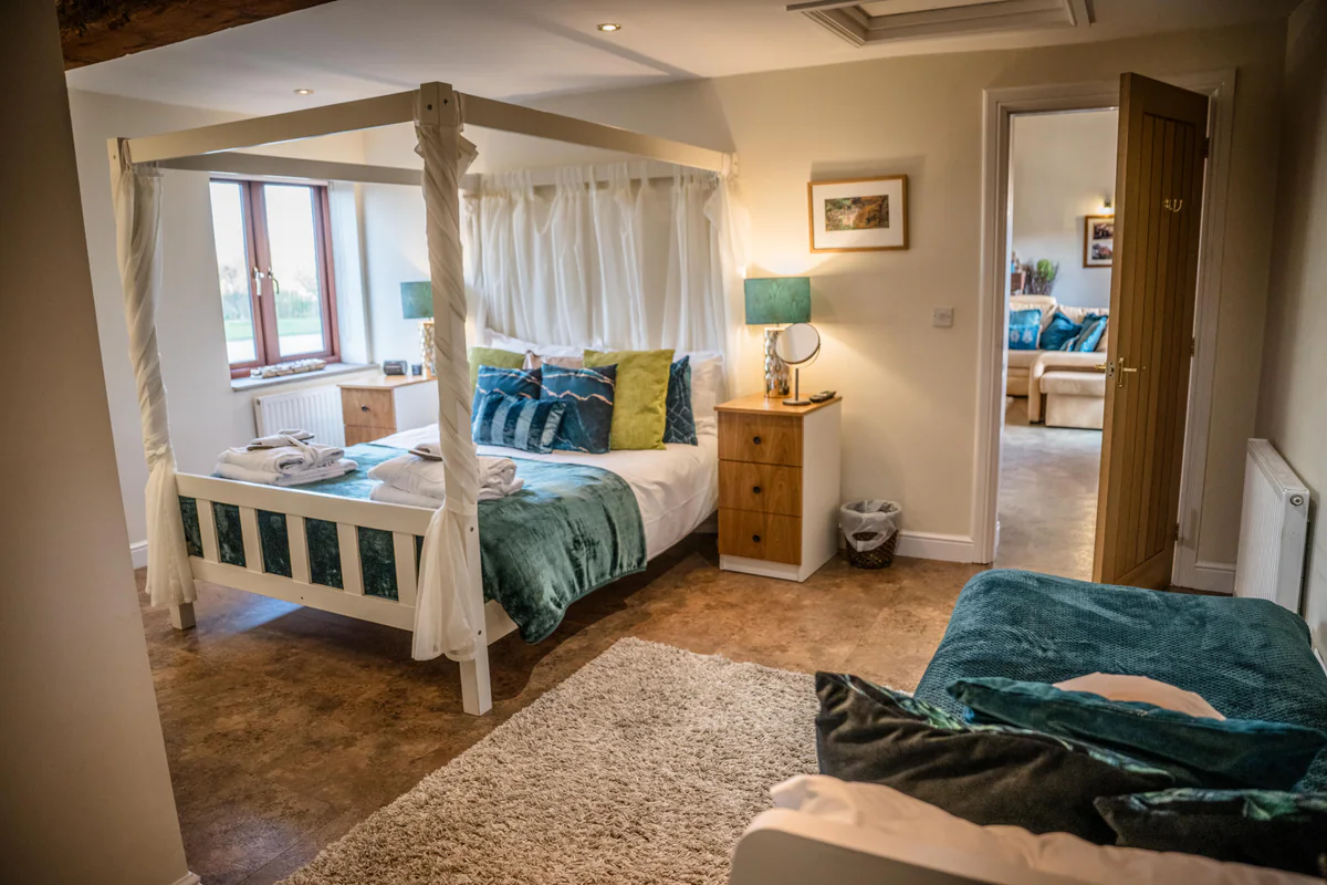 A four-poster bedroom in one of the Thief Hall cottages