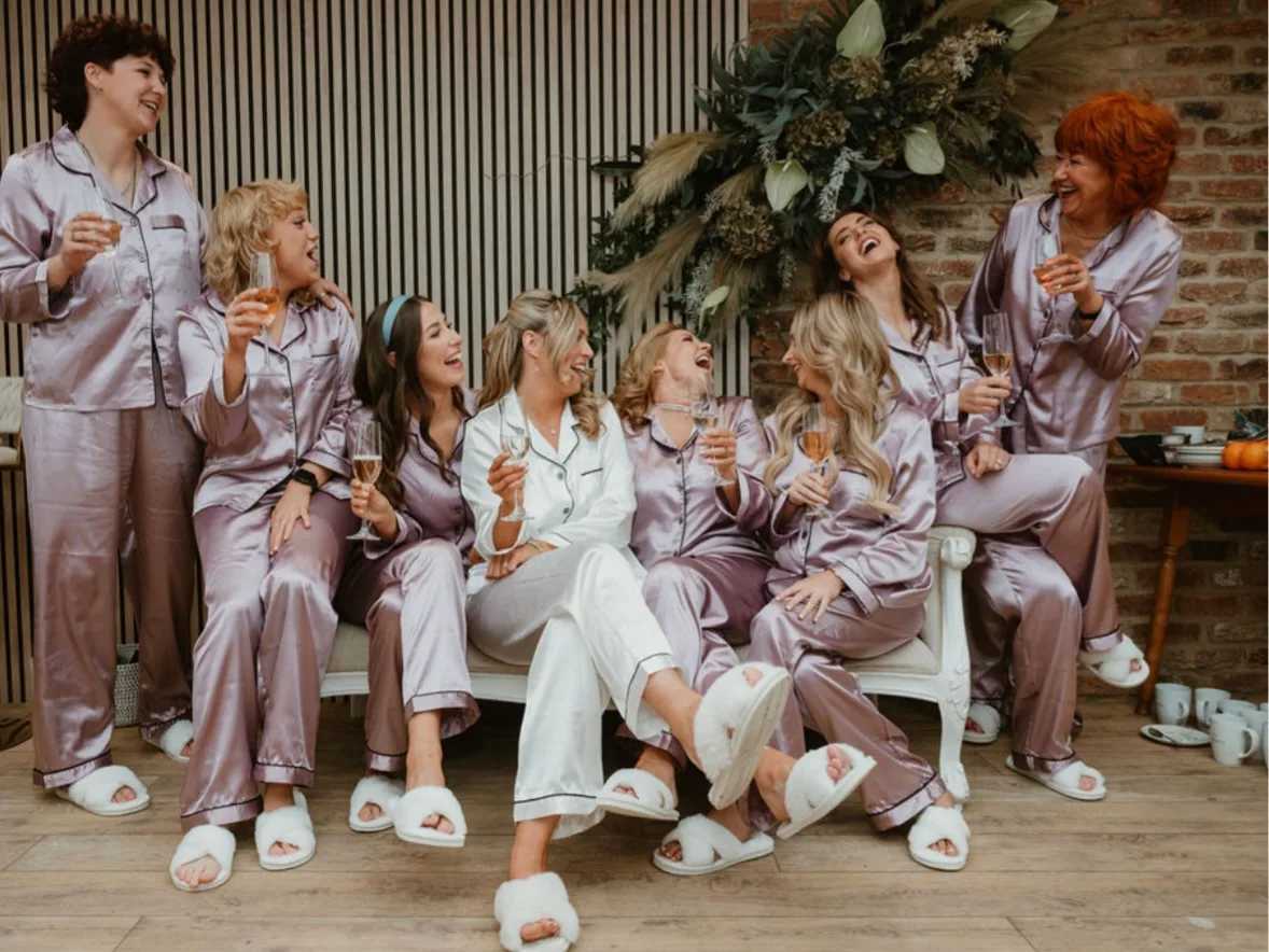 A bride with her wedding party in the getting-ready room