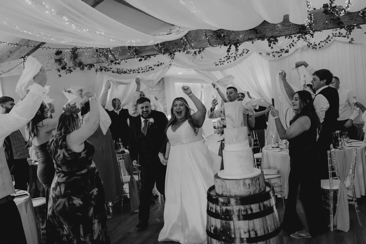 Newlyweds celebrating with their guests in the Hall