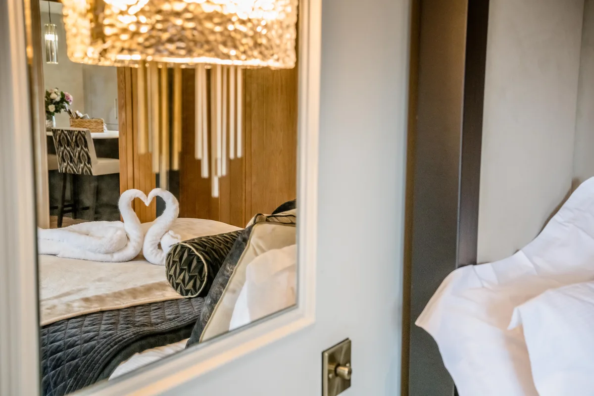 The wedding suite with swan-shaped towels on the bed